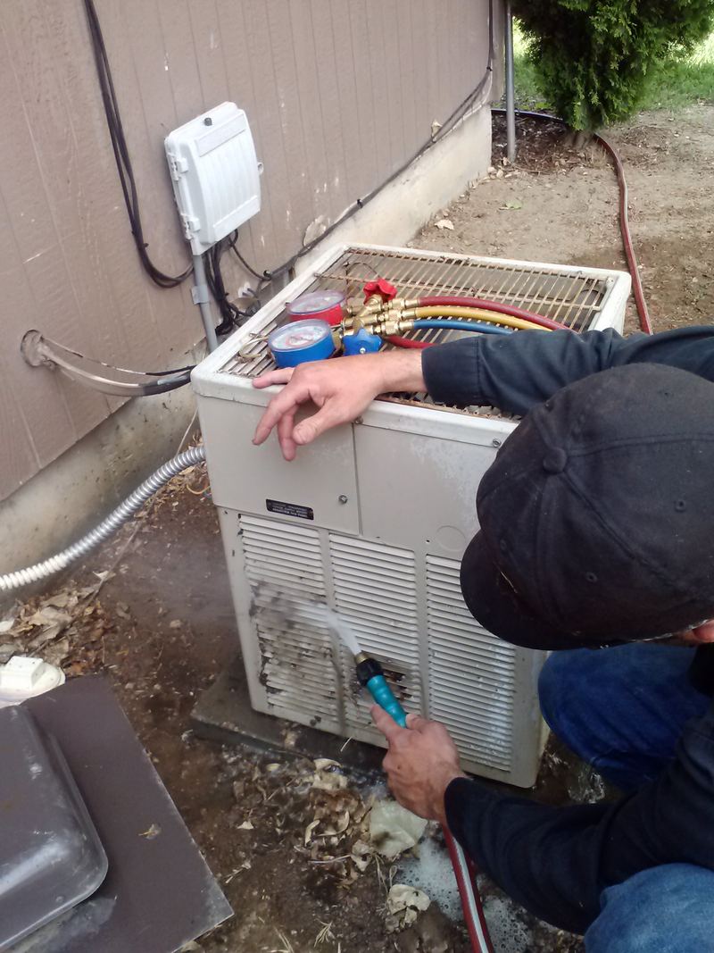 Cleaning an outdoor AC unit with gauges hooked up