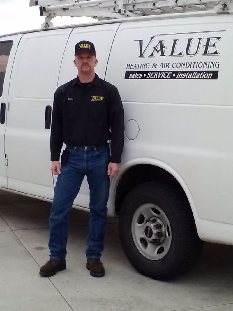 Dan standing next to a white Value Heating & Air Conditioning van
